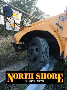 Left tire showing difficulty of Challenge for Bus Towing Company